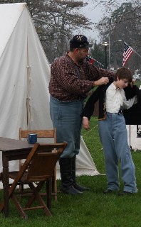 Scot helping Hunter get ready for the battle